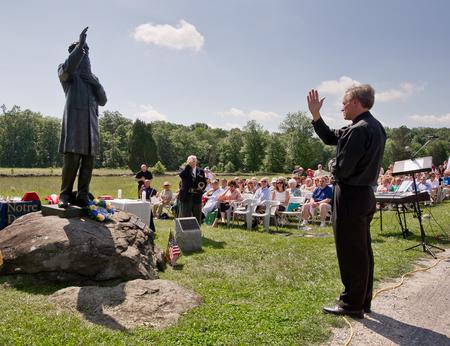 Father John Jenkins blesses the statue of Father William Corby at Gettysburgh
