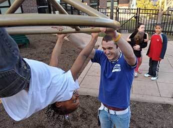 A ND student plays with a guest at the Center for the Homeless in South Bend