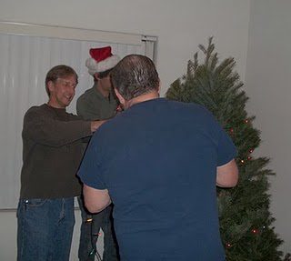 Fr Eric Schimmel, CSC decorating the Christmas tree