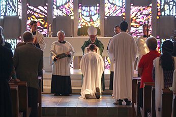 Bishop Colgan Lays His Hands On The Head Of Ryan Pietrocarlo, CSC