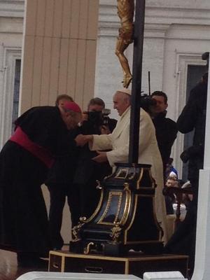 Bishop Daniel Jenky CSC kisses the ring of Pope Francis