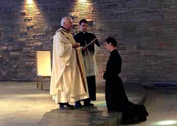 Fr Warner blesses Br DeAgostino, CSC