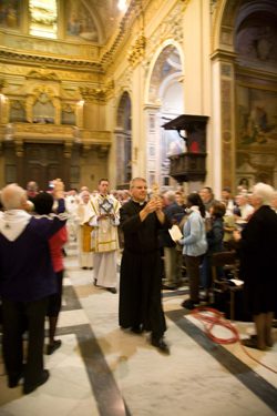 Br Paul Bednarczyk carries in a relic of St