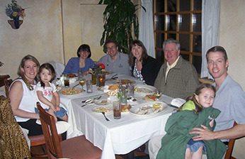 Fr Charlie McCoy, CSC having dinner with his family