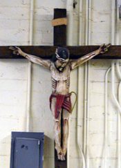 Crucifix in the main dining hall at Andre house