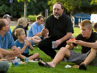 Fr Mark Ghyselinck, CSC with a University of Portland family