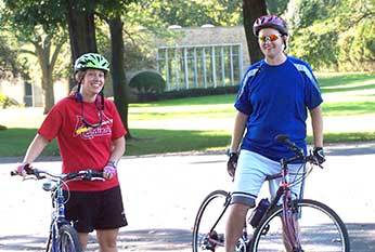 Fr Dan Ponisciak, CSC riding bikes with a friend
