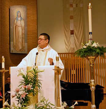 Fr Brian Ching, CSC preaching at his first Mass at St Joseph Parish, South Bend