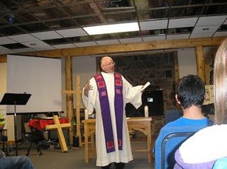 Fr Bob Epping, CSC saying mass
