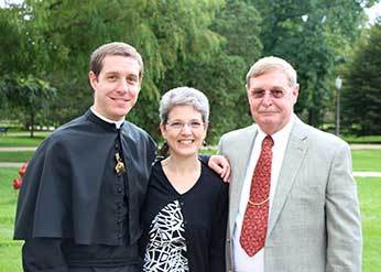 Fr Chase poses with his mom and dad