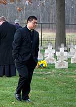 Fr Ching, CSC at the Community Cemetary