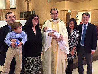 Fr Dan Ponisciak, CSC At His Niece's Baptism