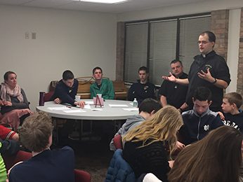 Fr Dan Ponisciak, CSC addresses a class at St Joseph Grade School