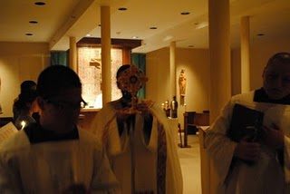 Fr Drew carries the relic of Brother Andre