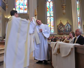 Fr Gerry Olinger being vested at Ordination