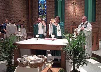 Fr Szakaly, CSC and Deacon Mouton, CSC at Mass