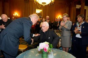 Vice President Joe Biden shakes hands with University President Emeritus Rev