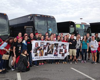 King's students pose with their bus