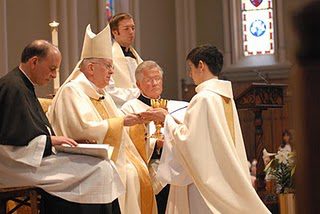Fr Vince Kuna accepting the offering at his Ordination