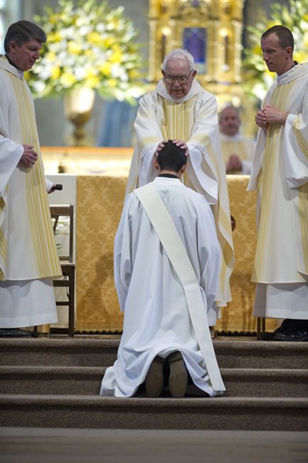 Laying on of hands by the priests