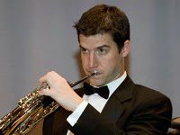 Mr Chris Mader playing his trumpet