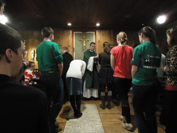 Hosting Mass in the Log Chapel