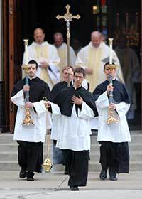 Mr Matt Hovde, CSC carries the crucifix in the Final Vows procession