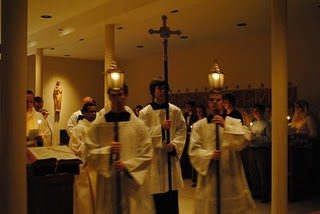Old College servers lead the processionout of the Chapel