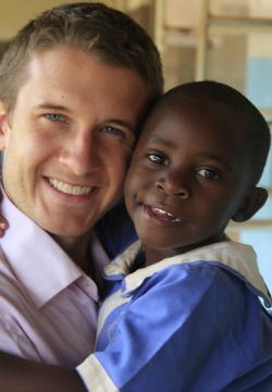 OLM student with a child in East Africa