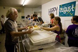 Serving meals to Andre House guests