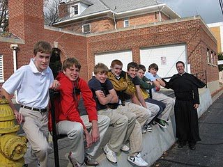 Fr John DeRiso, CSC with 8th grade students