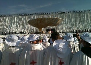 The 14,000 concelebrating priests welcome the Holy Father