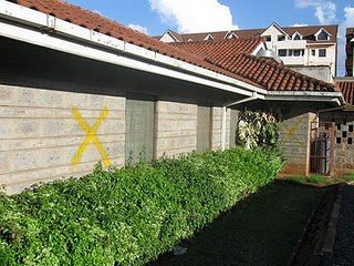 More buildings with yellow X