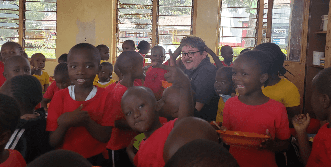 Nik Guiney on a mission trip educating children in Africa