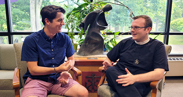 Br. James Walters CSC with a student at Stonehill College