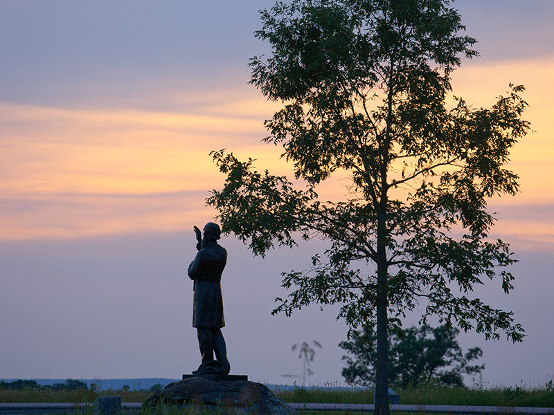 Statue of Fr. Sorin at Gettysburg at dusk