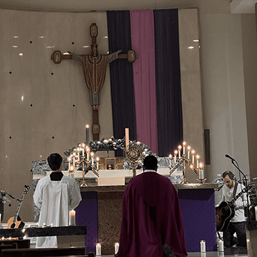 John Sebastian Gutierrez CSC adores the Blessed Sacrament