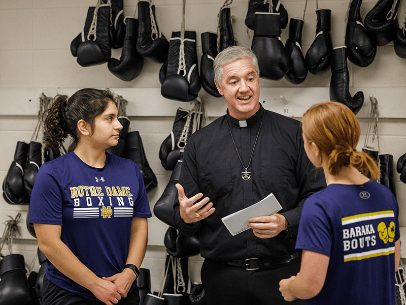 Fr. Tom Eckert CSC with students at Baraka Bouts