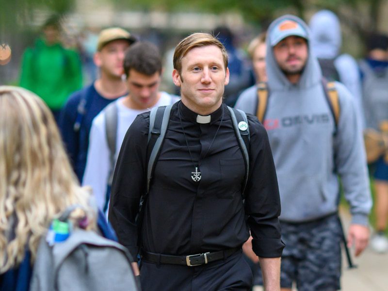 man walking outside at college