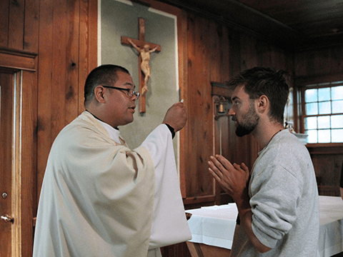 seminarian receiving communion