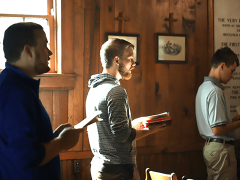 seminarian at prayer in the sunlight