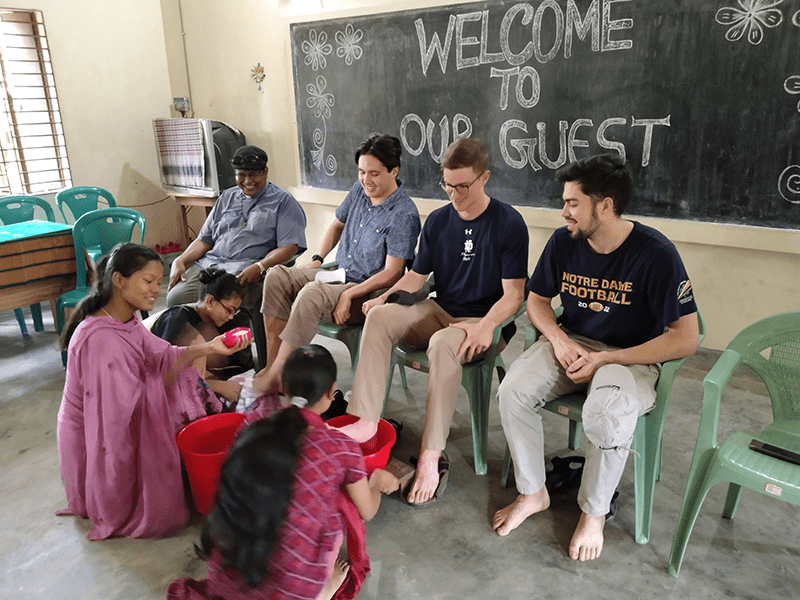 men receiving washing of the feet