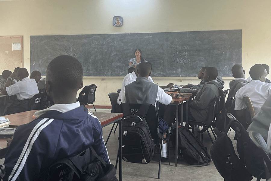 Woman teaching classroom of students