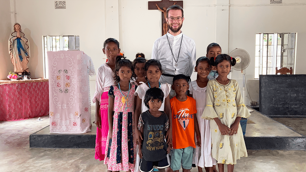 Br. Jimmy Henke with children at Teliapara Tea Garden