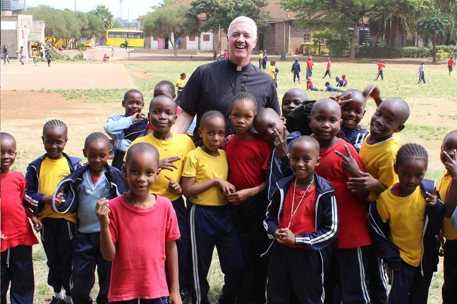 Fr. Tom with children from one of the shools supported by the Congregation of Holy Cross.