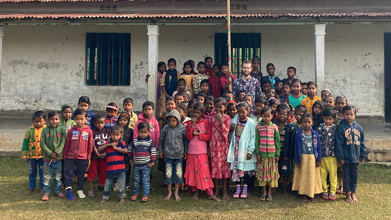 Br. Jimmy with a group of children in Bangladesh