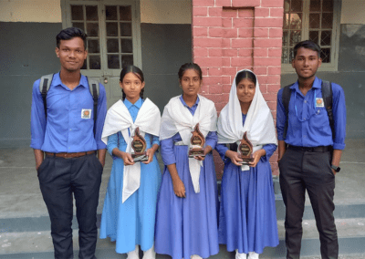 Bangladeshi girls and boys holding awards