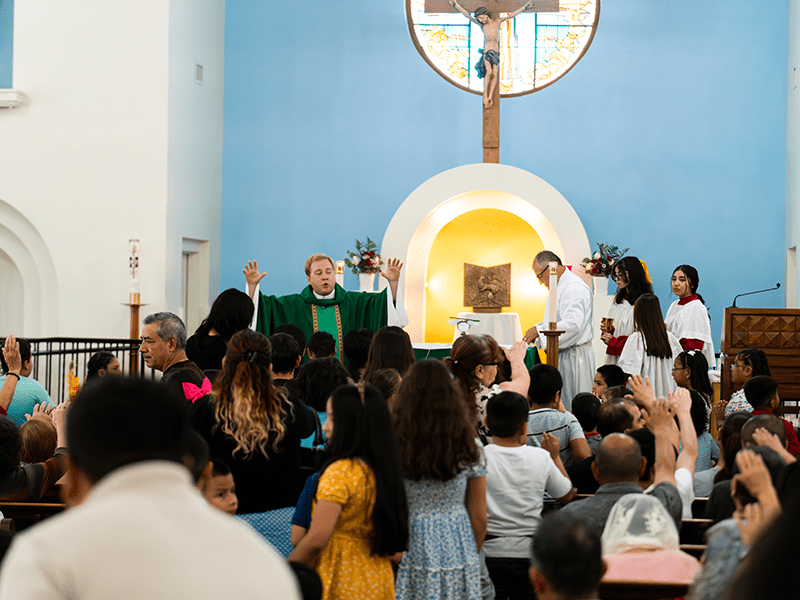 Blessing during Mass at St John Vianney Catholic Church in Goodyear, Arizona