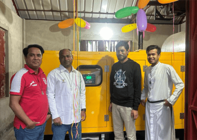 Men standing by generator