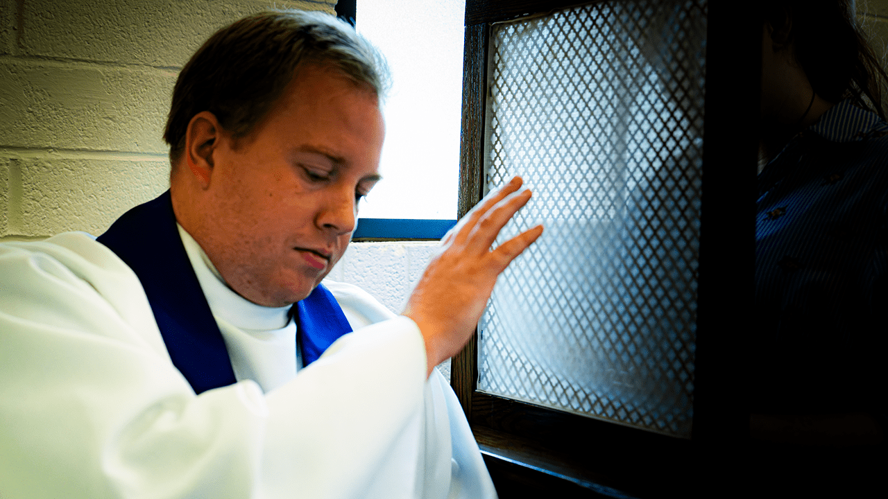 Fr. Andrew Fritz granting absolution in the confessional